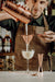 Bartender Straining And Pouring A Cocktail